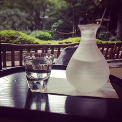 Close-up of drink in vase on table