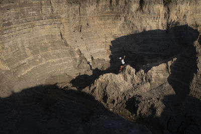 One man trail running down through a ridge on a sandy terrain