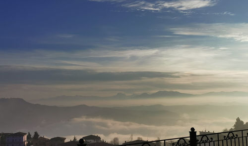 Scenic view of silhouette mountains against sky during sunset