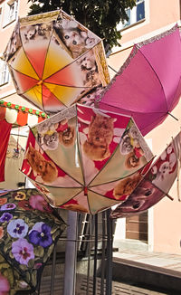 Multi colored decoration in traditional clothing for sale at street market