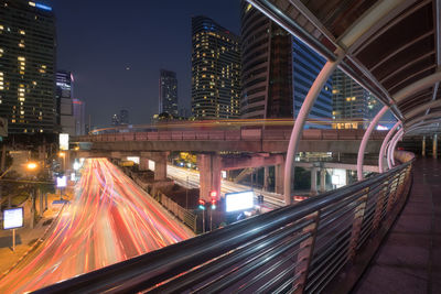 Light trails on road in city at night