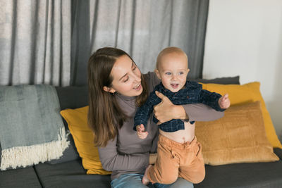 Portrait of mother and daughter at home