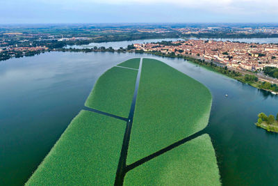 High angle view of river amidst buildings against sky