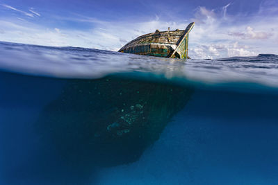 Old abandoned ship in sea