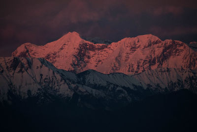 Scenic view of snowcapped mountains against sky during winter