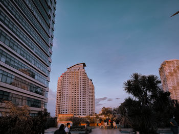 Low angle view of modern buildings against sky