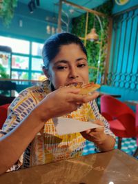 Portrait of woman eating food