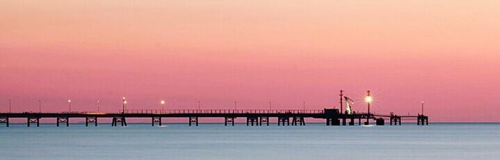 SCENIC VIEW OF SEA AT SUNSET