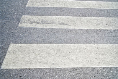 High angle view of road sign on street