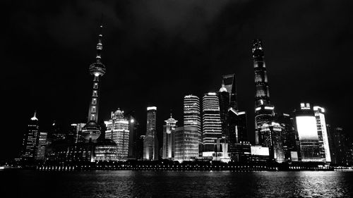 Illuminated buildings in city at night