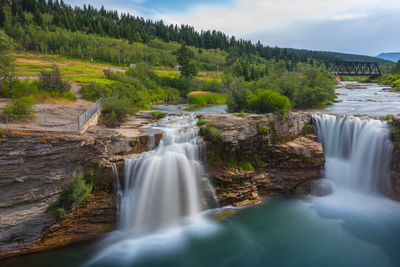 Scenic view of waterfall in forest