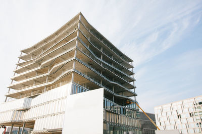 Low angle view of modern building against sky in city