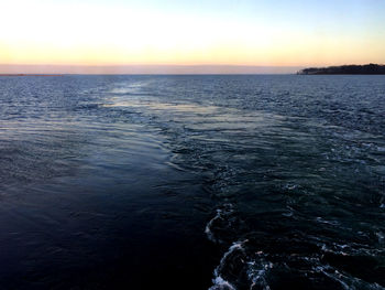 Scenic view of sea against sky at sunset