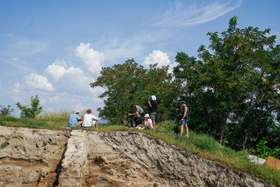 Excavation director gives interview in the filed during excavations in a hot summer day