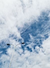 Low angle view of street light against sky