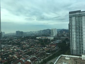 High angle view of buildings in city against sky
