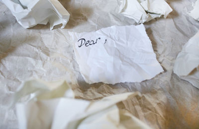 High angle view of text on bed