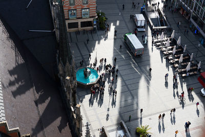 High angle view of people walking on street in city