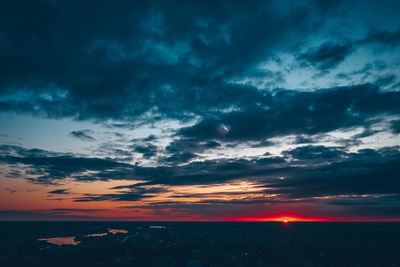 Scenic view of dramatic sky over sea during sunset