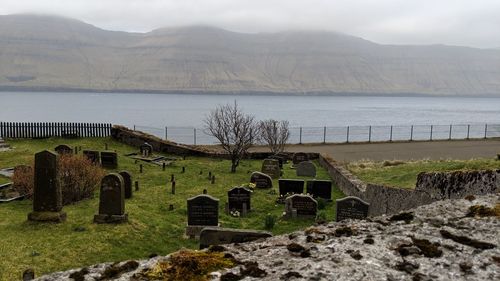 View of cemetery and mountains against sky