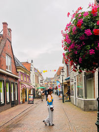 Rear view of woman walking in city