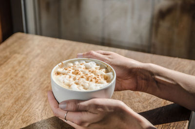 Close-up of hand holding ice cream