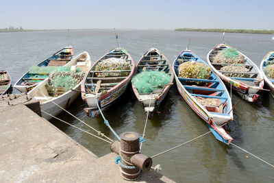 High angle view of boats moored in sea against clear sky