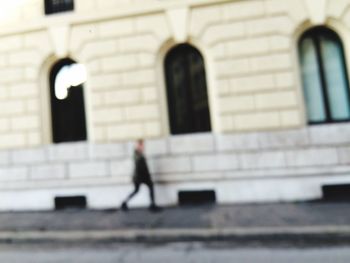 Woman standing in front of building