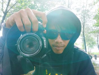 Portrait of man photographing