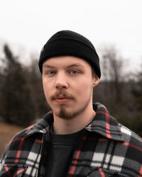 Portrait of young man standing in a forest