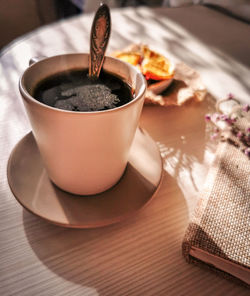 Close-up of coffee cup on table