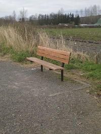 Empty bench on field