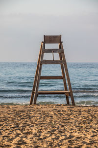 Built structure on beach against sky