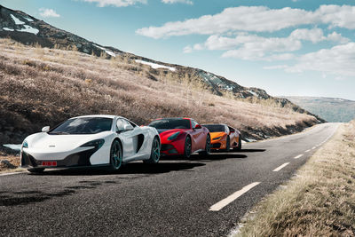 Cars on road against sky