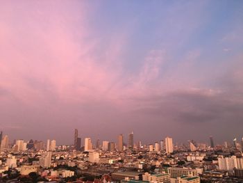 Cityscape against sky during sunset