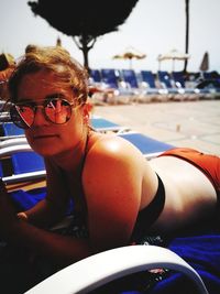 Portrait of smiling young woman in car