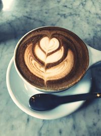 High angle view of cappuccino on table