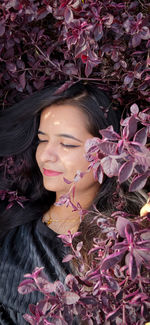 Portrait of woman with pink flowers