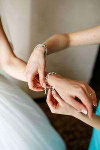 Cropped hand of woman with nail polish