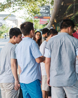 Rear view of people enjoying in city