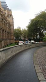 Road by city against sky