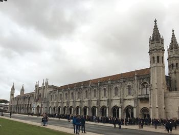 People in front of historical building