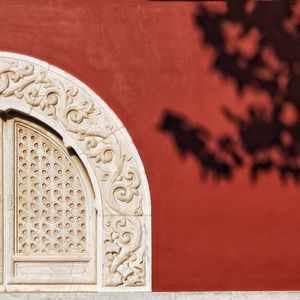 Close-up of carved on wall of building