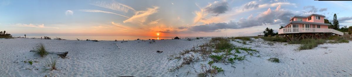 Panoramic view of sea against sky during sunset