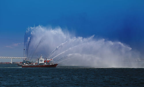 Water discharge training of firefighting boats at the port of yokohama, japan