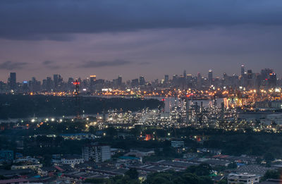 High angle view of illuminated city buildings at night