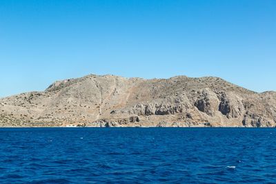 Scenic view of mountain against clear blue sky