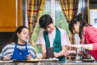 Young couple standing on table