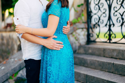 Midsection of women standing outdoors