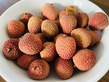 High angle view of strawberries in plate on table